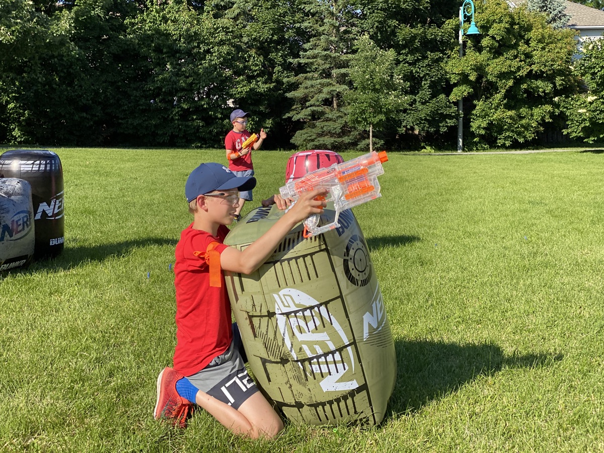 Player taking careful aim with a foam dart blaster